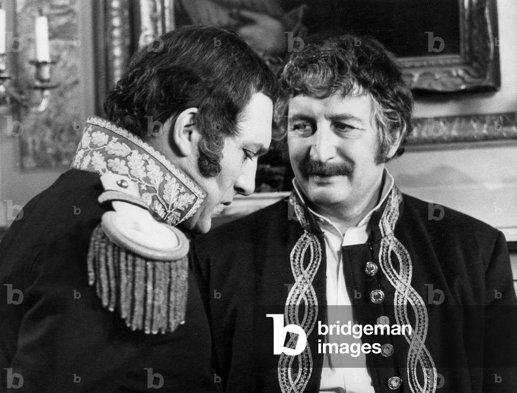 Jacques Fabbri (In The Role Of Schulmester) And William Sabatier (In The Role Of The General Savary) During The Shooting Of The Film “Schulmester” By Jeanpierredecourt On December 12, 1972 (b/w photo)