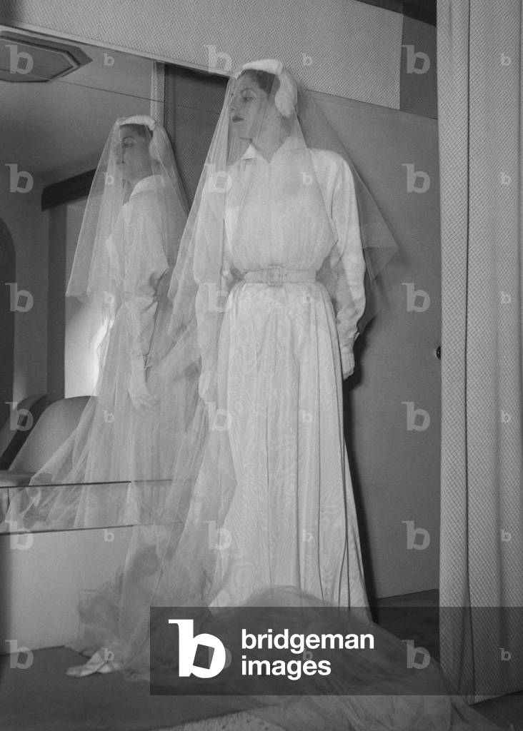 Wedding gown by Jean Bader, Paris, September 1949 (the wedding gown is in fact a travel suit) (b/w photo)