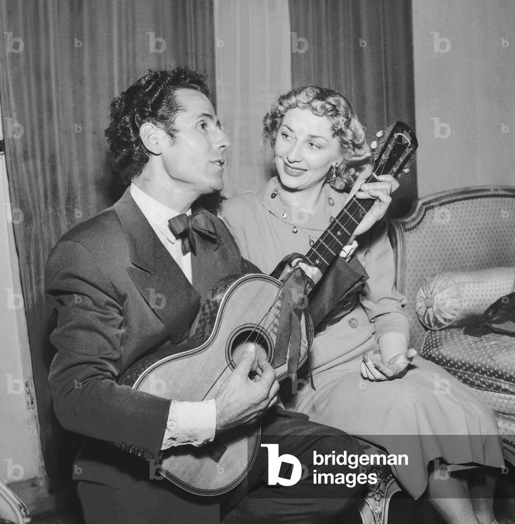 Guitar player Jose Tores and dancer Marianne Ivanoff in Paris, July 13, 1951 (b/w photo)