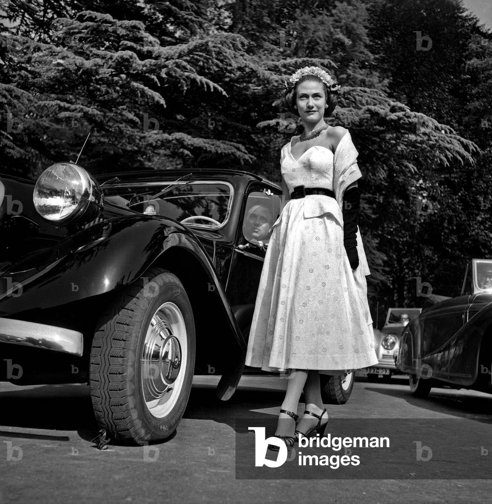 Car Elegance Contest in Bois De Boulogne, Paris : Marcel Rochas and his Young Wife Helene Rochas June 23, 1949 (b/w photo)