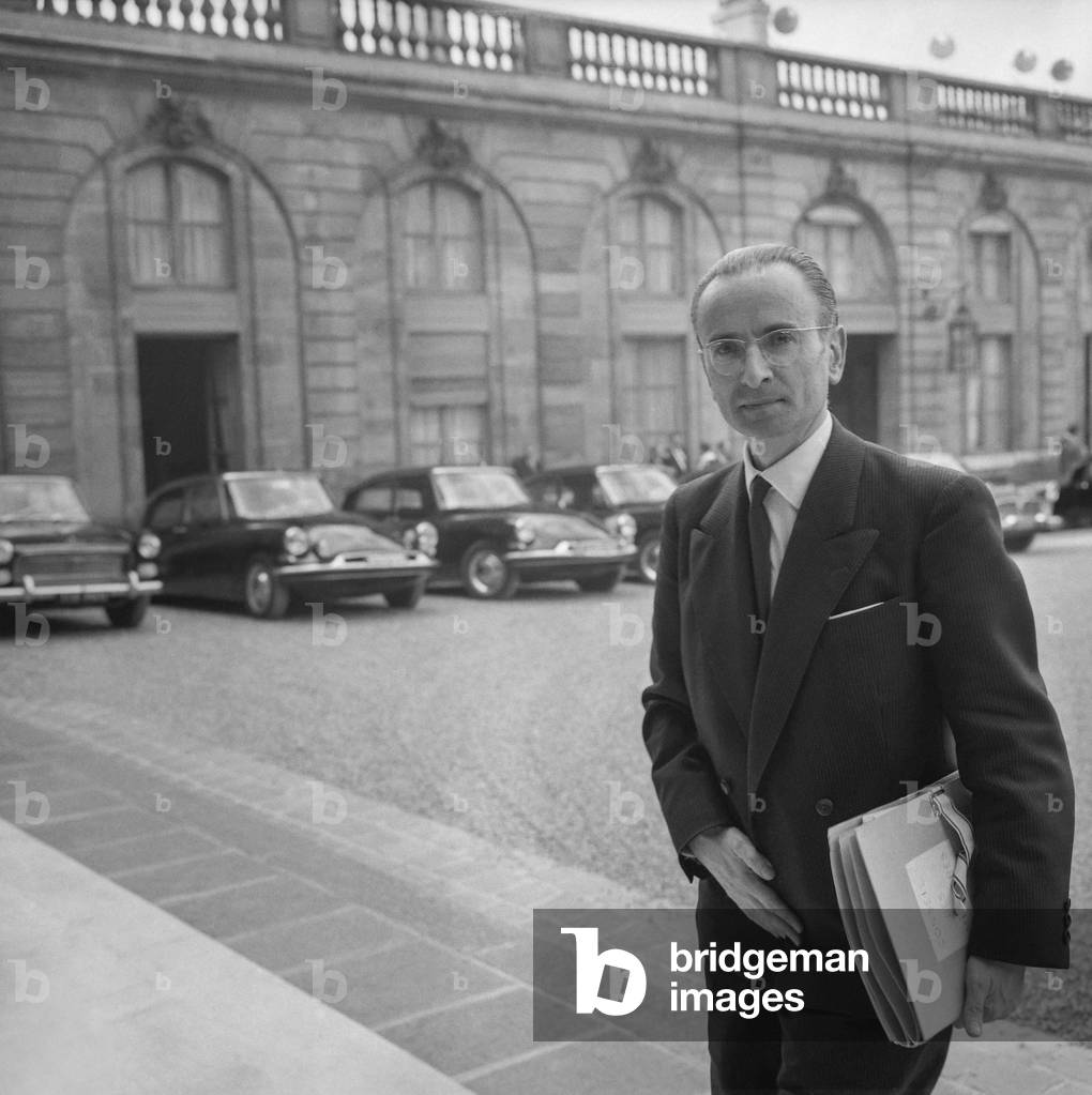 French politician Paul Bacon, French Employment minister, arriving at the Elysee, Paris, to attend the council of ministers, August 24, 1960 (b/w photo)