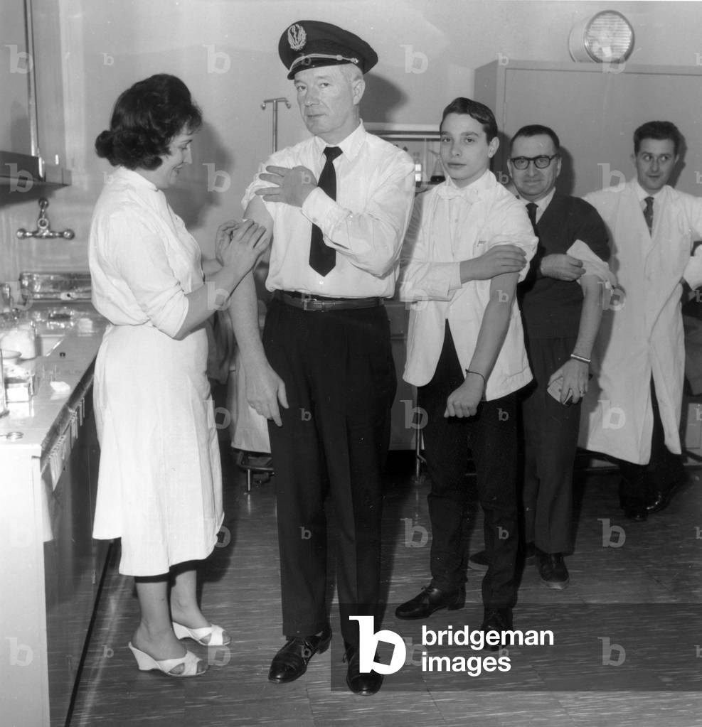 Smallpox Vaccination at Orly Airport in Paris on December 30, 1961 (Because of A Sick Pakistani Passenger) (b/w photo)