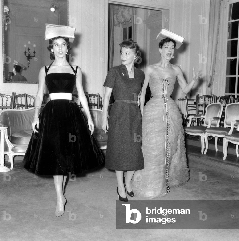 In Dior Room Olivia De Havilland Is Learning To Be A Model With Victoire and Lucie Daouphars, Called Lucky, October 28, 1955 Because She Is Shooting in Paris A Movie (b/w photo)