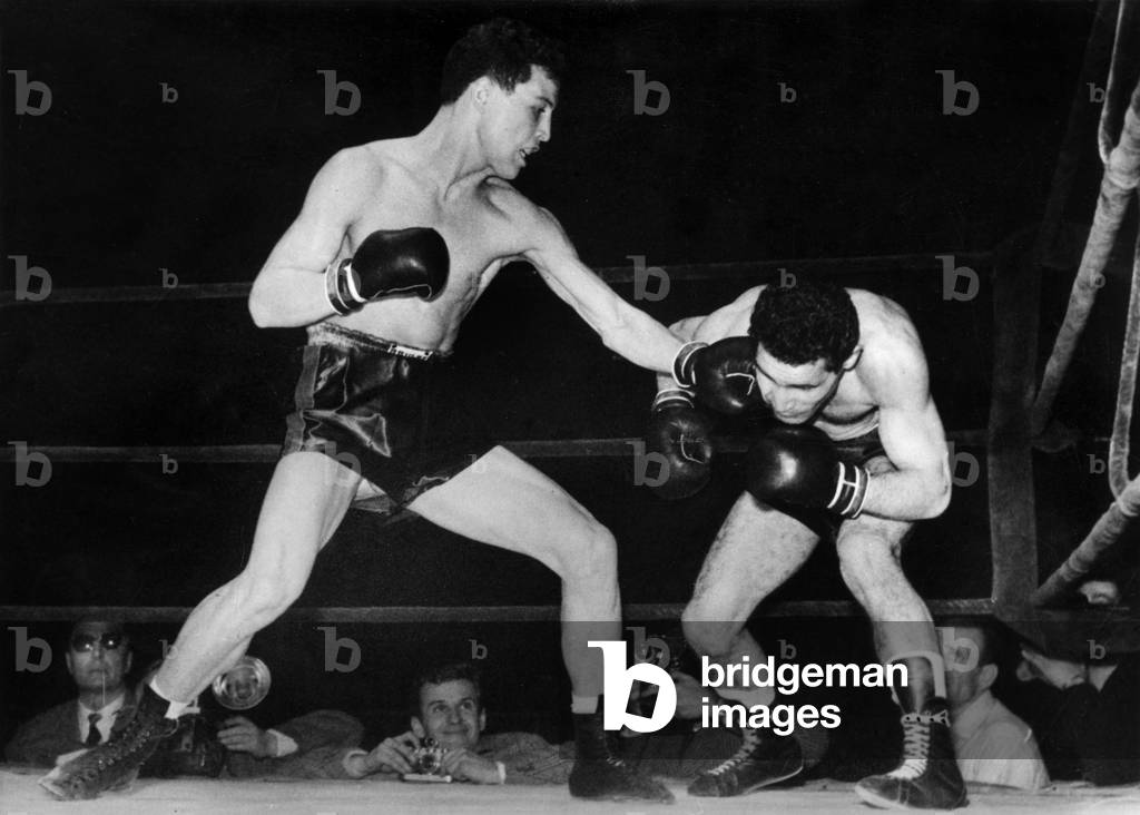 Cherif Hamia (L, The Winner) during his Boxing Bout Against Robert Cohen, World Champion, December 10, 1955 (b/w photo)