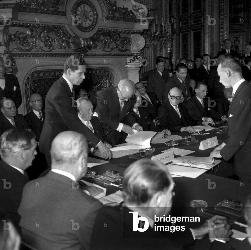 Signature of Treaty of Defence of European Community on May 27, 1942 in Paris : L-R (Seated) : Konrad Adenauer (Germany) Paul Van Zeeland (Belgium) Robert Schuman (France) Alcide De Gasperi (Italy) Joseph Bech (Luxemburg) and Dirk Stikker (Holland) (b/w photo)