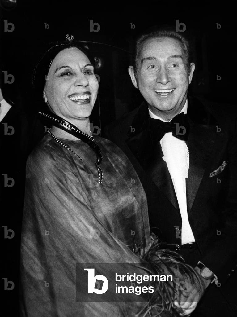 French Actress Alice Sapritch and Singer Charles Trenet at Premiere of The Revue of The Lido in Paris, December 13, 1971 (Alice Sapritc Is Wearing A Turban By Jean Barthet) (b/w photo)