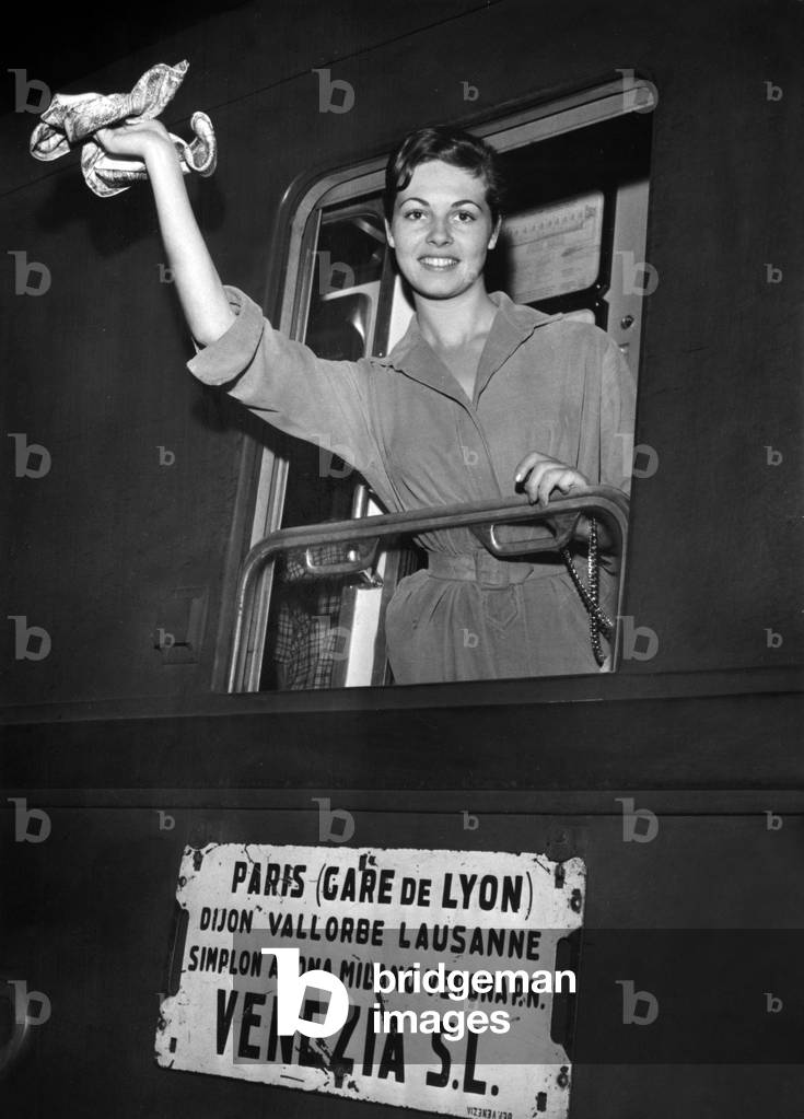 In Paris on September 2, 1957 : Michele Mercier Is Going To Venice For The Film Festival (b/w photo)