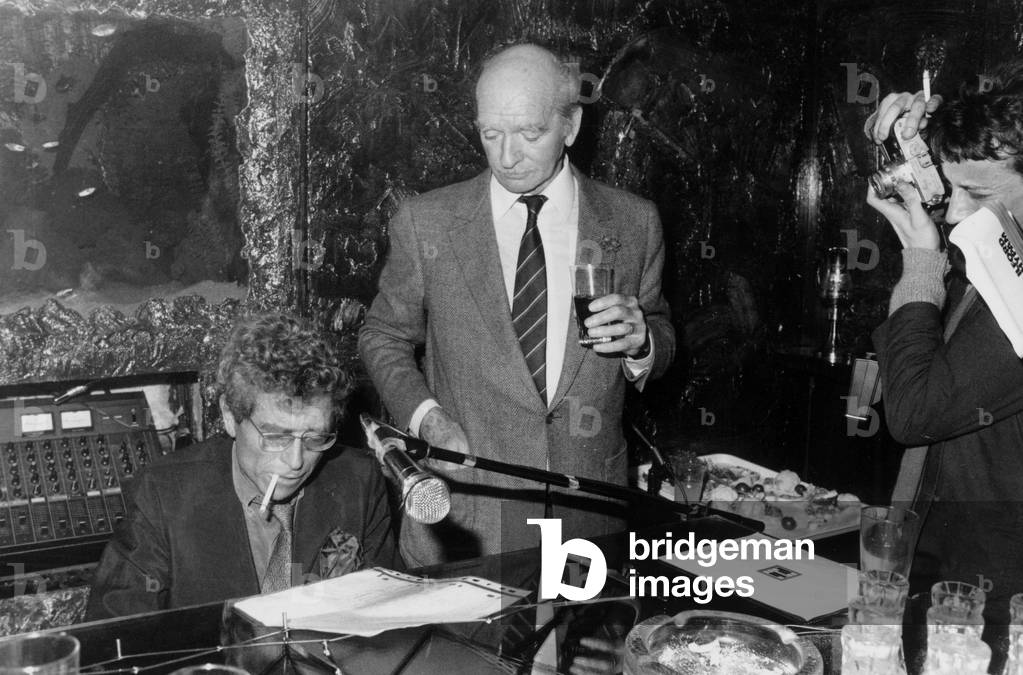 Darry Cowl and Eddie Barclay on October 29, 1986 (b/w photo)