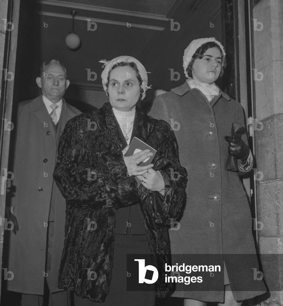 Jacqueline Tribout, with her daughter Jeannine, after her wedding with her dead husband Jean Vernet (dead in 1944), in Lagny, France, December 3, 1960 (b/w photo)
