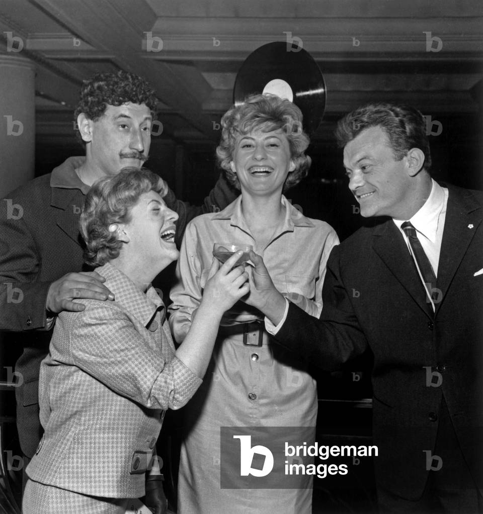 During a Ceremony at the Theatre Des Champs Elysees During the 1958 Grand Prix Du Disc Here Four Winners of the Category “Songs” Drinking Success After The Proclamation Of Results From Left To Right Georges Ulmer Rene Louis Laffroque Lucette Raillat And Simone Langlois May 7, 1958 (b/w photo)