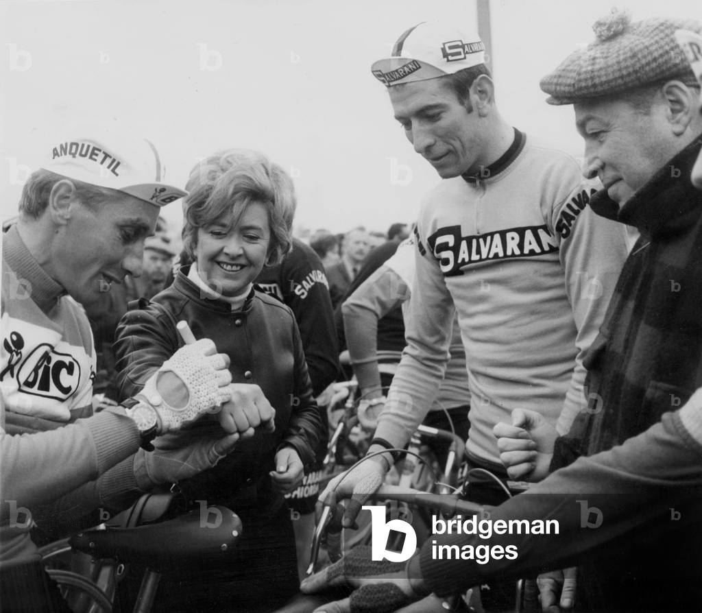 Cyclist Jacques Anquetil Signing Autograph To Singer Mick Mickeyl Durig The Paris-Nice Cycling Race March 10, 1969 (b/w photo)