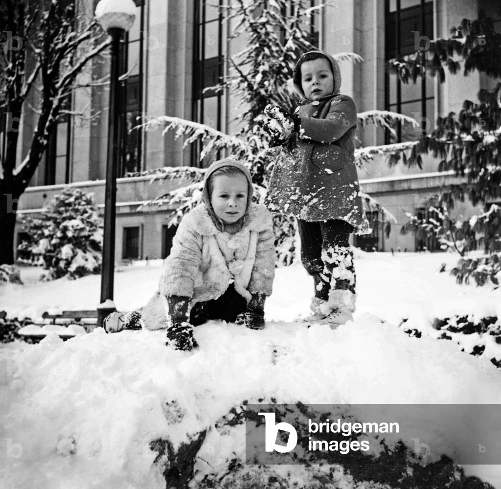 Children Playing in The Snow, January 1945 (Winter) (b/w photo)