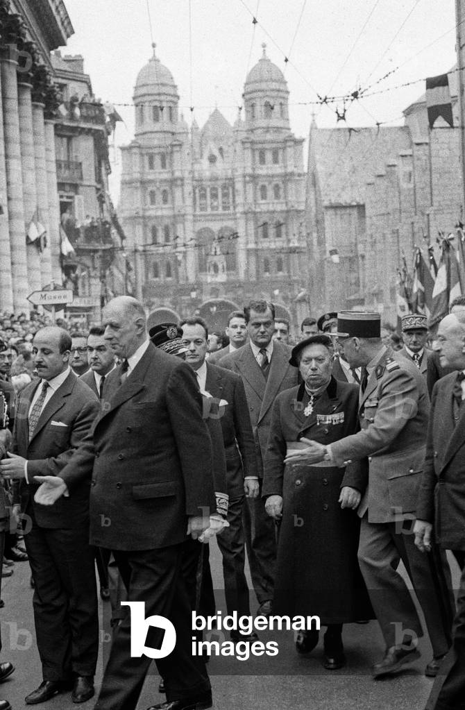 Charles De Gaulle Waliking Among The Crowd, Followed By Ministrer of Transport and Housing Pierre Sudreau (1919-2012), Felix Kir (1876-1968), Colonel Gaston Armand De Bonneval and Mr Berthoin. Dijon, France, April 20Th, 1959. (b/w photo)