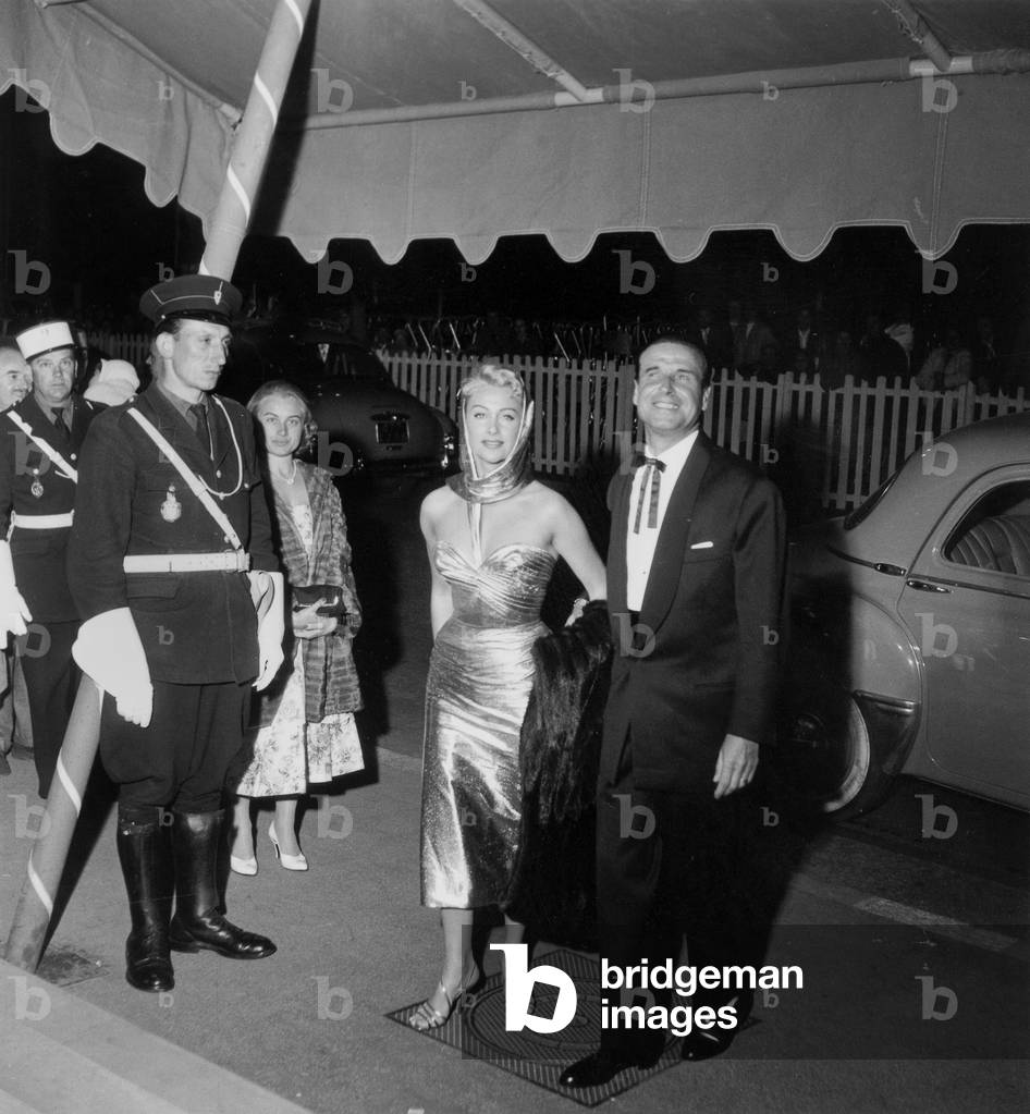 Martine Carol and Director Christian Jaque at Cannes Film Festival May 3, 1956  (b/w photo)