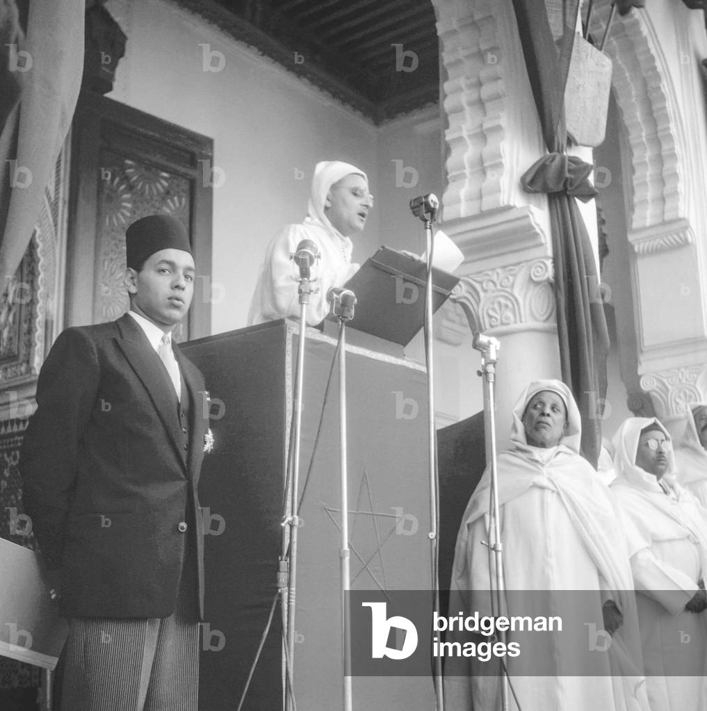 Sidi Mohammed (future king Mohamed V of Morocco) making a speech for his 24 years of reign, on l is Moulay Hassan (future king Hassan II), November 20, 1951 (b/w photo)