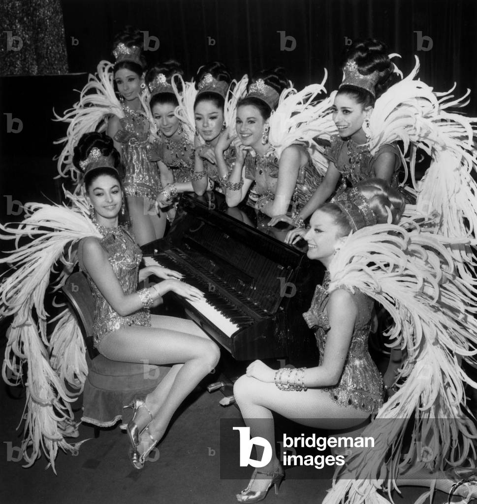 The “Super Girls” Around A Piano Composed By The Most Pretty Girls From 6 Different Countries Will Make The Top Of The Carnal Review The New Cabaret Des Champs Elysees January 6, 1966 (b/w photo)