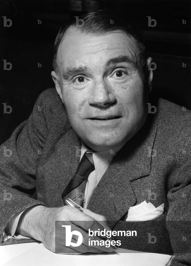 Raoul Dujardin received the Grand Prix Du Roman from the Academie De Province for his Roman Rue Basse. March 23, 1954 (b/w photo)
