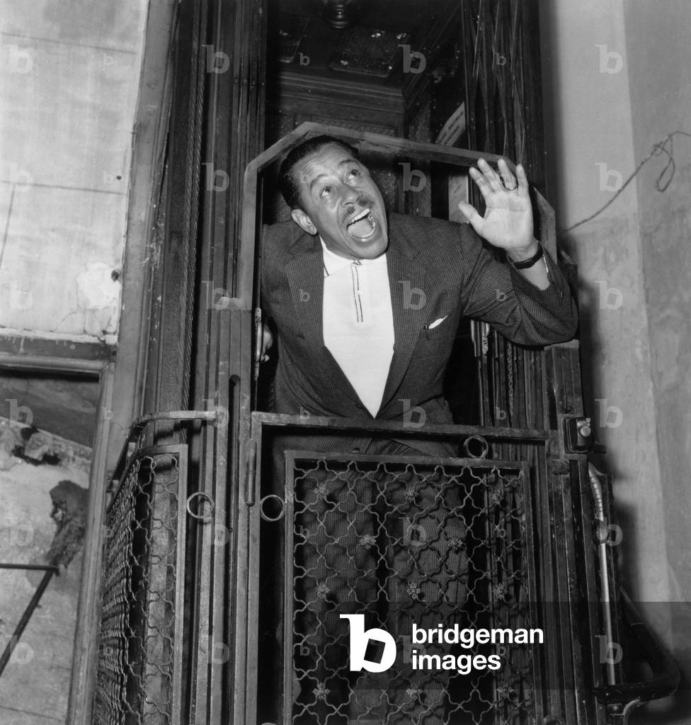 Cab Calloway (1907-1994) American Jazz Singer and Bandleader, here in A Lift at T He Olympia in Paris, May 20, 1958 (b/w photo)