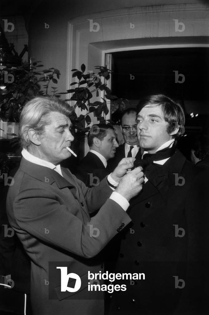 Jean Marais Is Going To Make Ready To Wear : here Dressing A Model, Paris, February 2, 1970 (b/w photo)