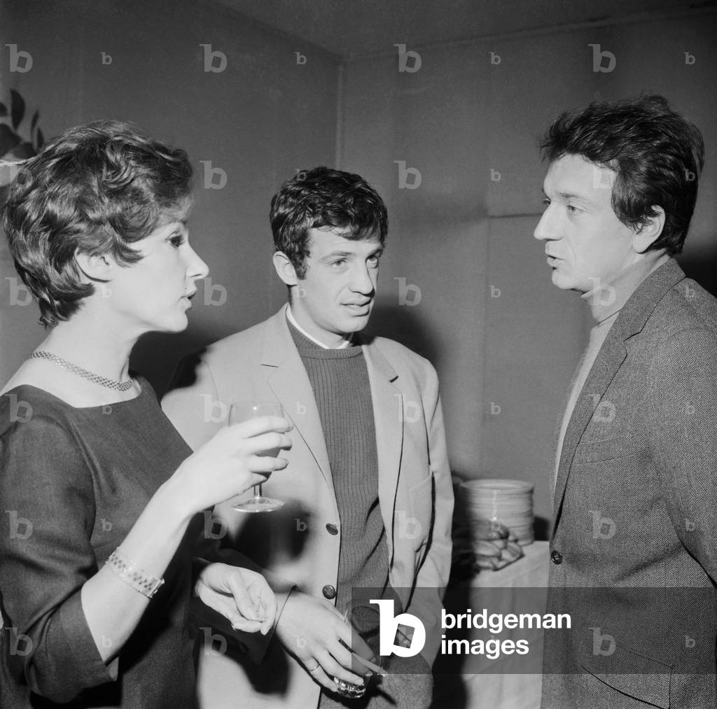 French actress Nadine Alari with French actors Jean Paul Belmondo and Jean Pierre Cassel at the press conference on the 36th Union des Artistes Gala on December 23, 1965 (b/w photo)