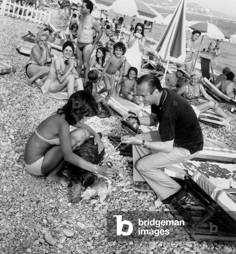 Jacques Chirac, French Prime Minister, on The Beach in Nice With his Dog August 23, 1974 (b/w photo)