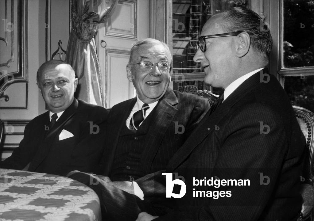 American Secretary of State John Foster Dulles, French Prime Minister Guy Mollet (R) and Christian Pineau (L) Foreign Minister, Meeting at Hotel Matignon in Paris, January 12, 1957 (b/w photo)