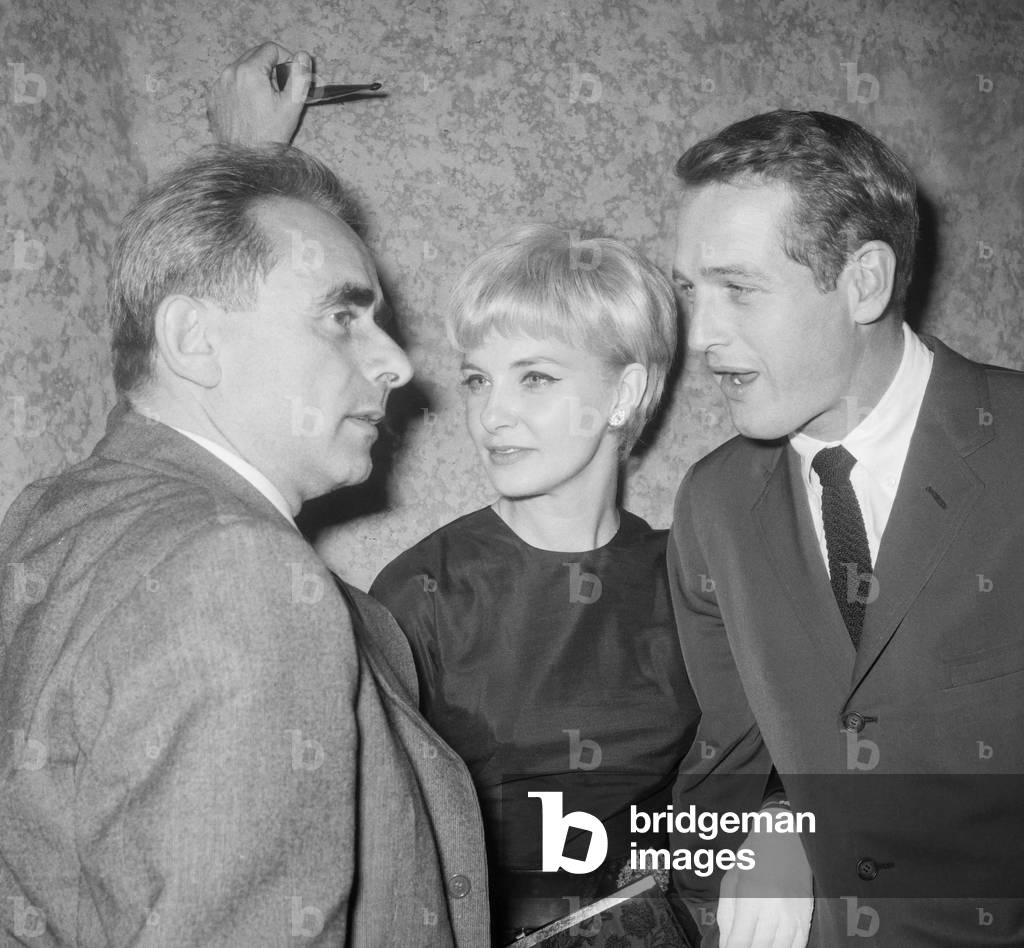Paul Newman and his wife Joanne Woodward arriving at a reception given for us on the Champs Elysees, Paris, October 13, 1960, on l : French director Henri Georges Clouzot (b/w photo)