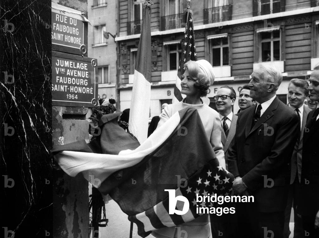 The Faubourg St Honore Street in Paris Is Twined With The 5Th Avenue in New York : here Mrs Herve Alphand (Wife of The French Ambassador in Washington) Unveiling The Plate With Maurice Chevalier May 18, 1965 (b/w photo)