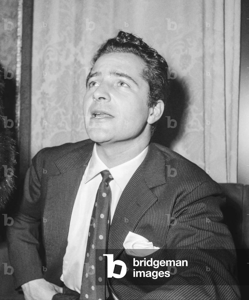 Italian actor Rossano Brazzi during a party in Paris, February 8, 1951 (b/w photo)