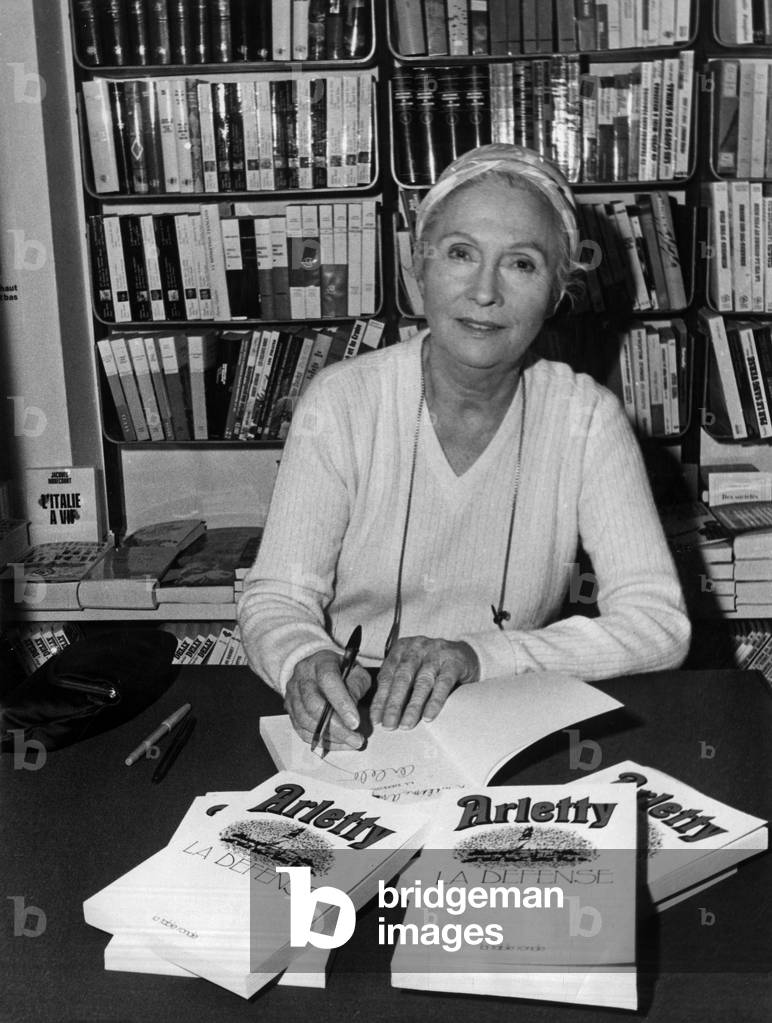 French Actress Arletty Signing her Book (Memories) in A Bookshop in Paris February 25, 1971 (b/w photo)