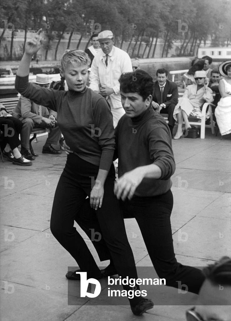 Daniel Felin and Dany Robin on The Set of The Film Good Evening Paris, Dancing in Front of Tourists, on A Boat. Paris, September 12, 1956 (b/w photo)