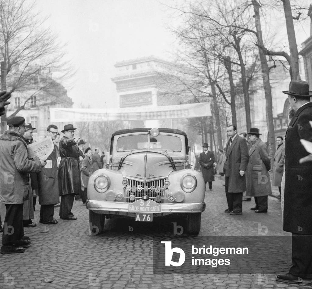 Monte Carlo Rally : pilots are controlled in Paris on January 25, 1951 : Heick and Leuthold (Denmark) in their Ford V 8 car (b/w photo)