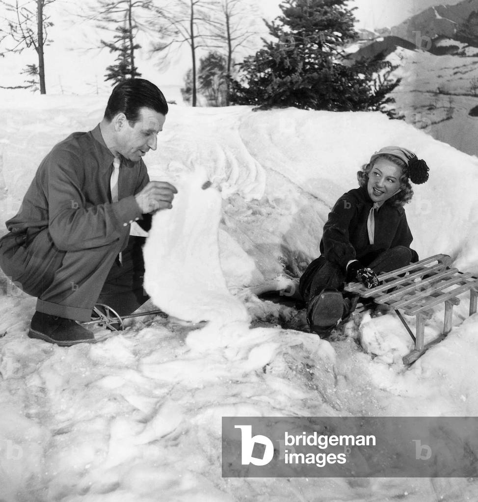 Director Christian Jaque Directing Actress Martine Carol While Rearranging False Snow on Set of Film Adorables Creatures May 23, 1952  (b/w photo)