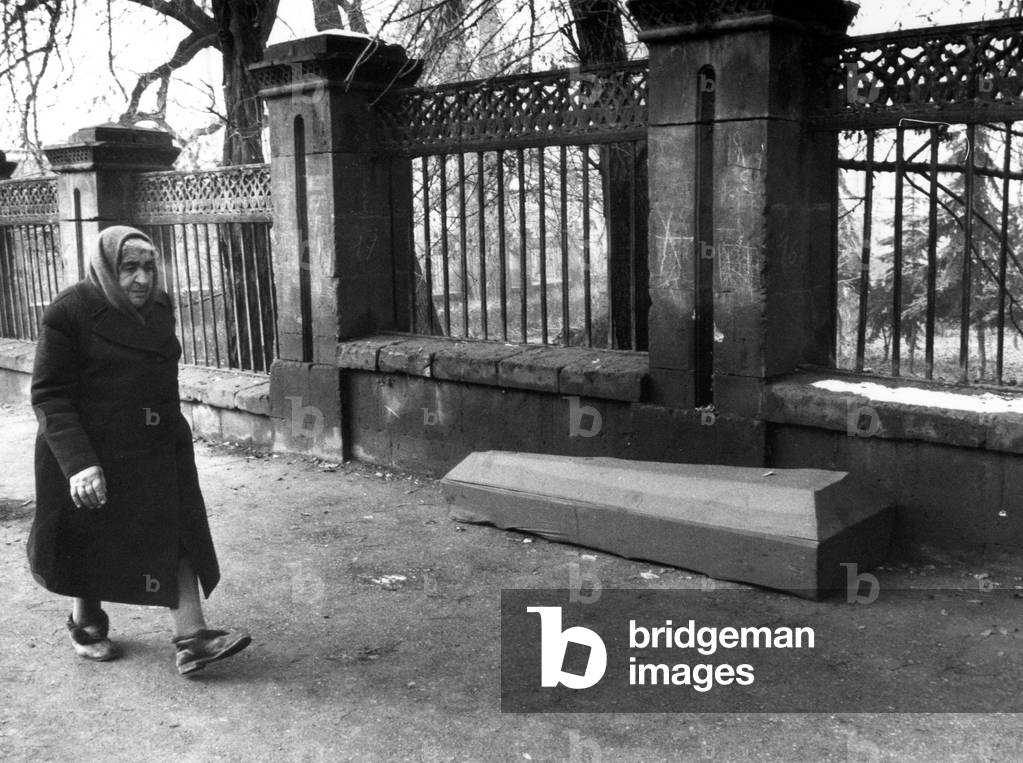 After The Earthquake In Leninakan, Armenia On December 7, 1988, An Old Lady In A Street Of Leninakan 17 December 1988 (b/w photo)