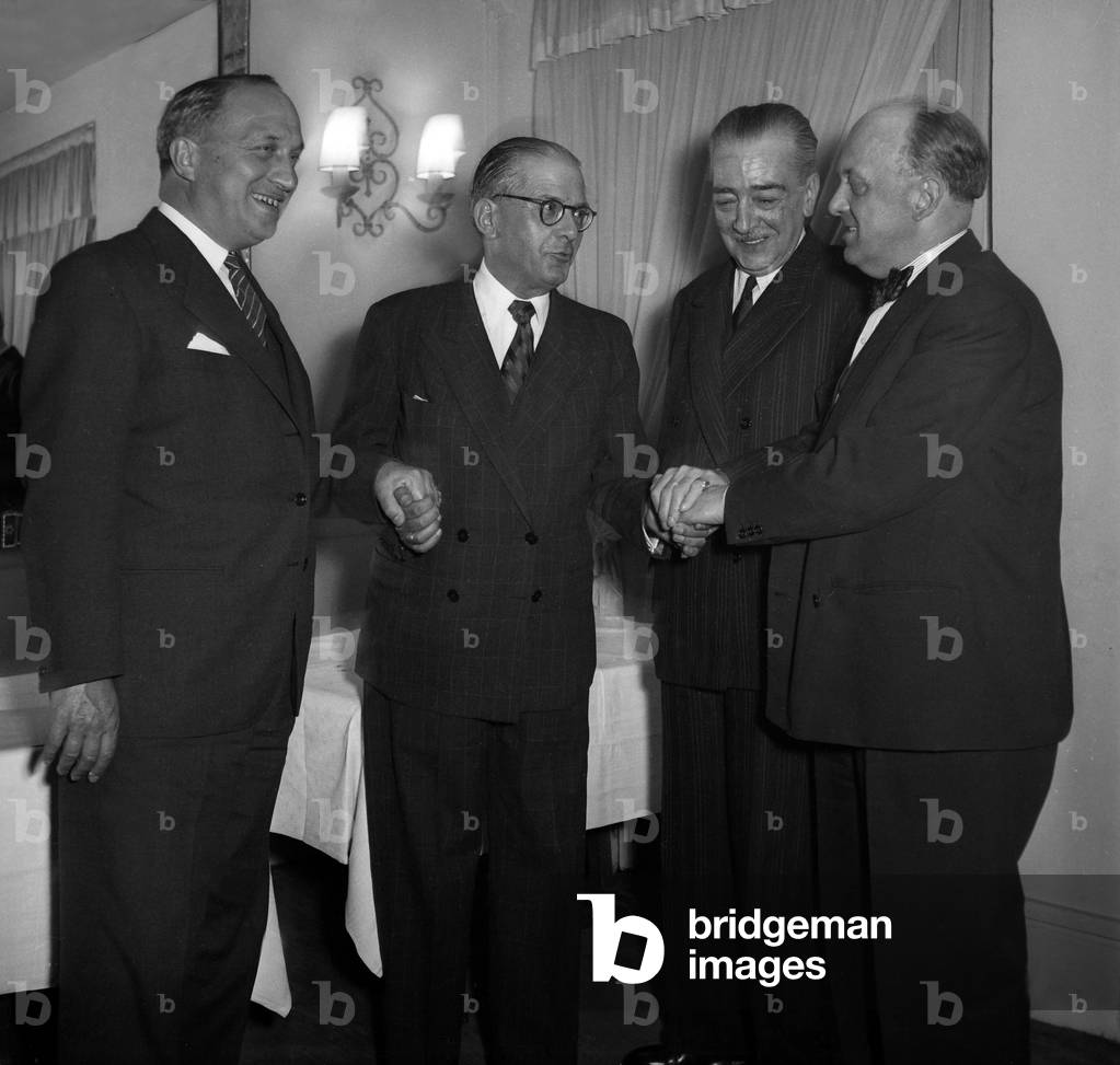 Writer Henri Bosco Felicites By Three Ambassadors In Activity: Quaroni, Ambassador Of Italy In Paris, Menenmencioglu, Ambassador Of Turkey (Left) And Baron Guillaume, Ambassador Of Belgium (Right) After receiving the Ambassador Award for His Book Malicroix At Cabaret, Avenue Du President Roosevelt, June 4, 1949. Neg: 22709 (b/w photo)
