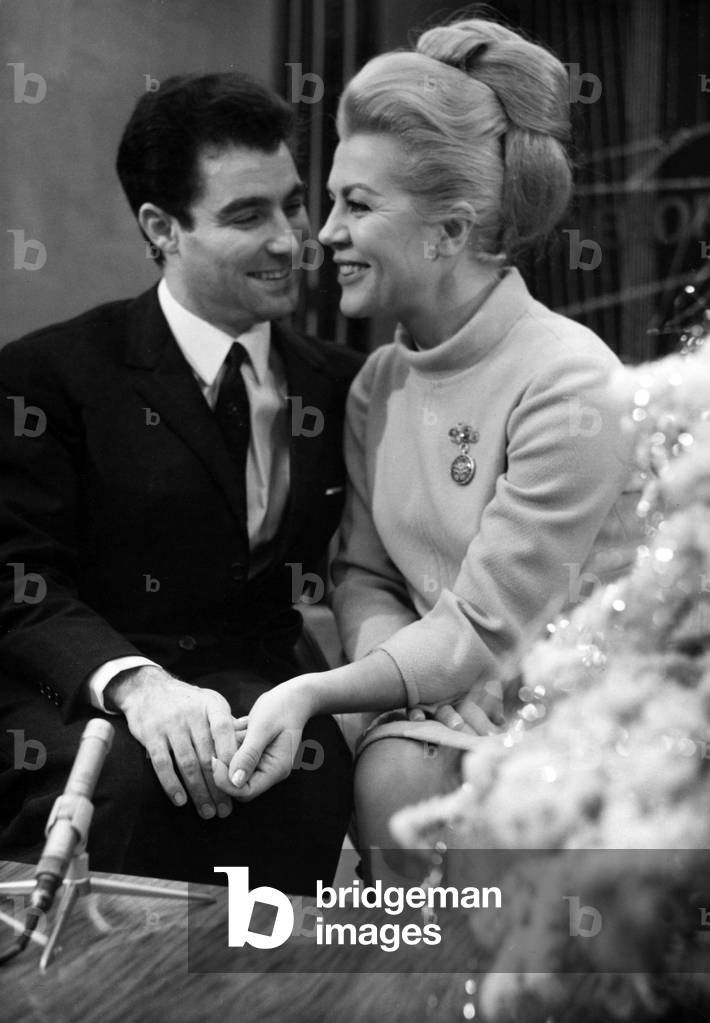 Opera Singer Jane Rhodes and her Husband Roberto Benzi at Orly Airport, Paris, Before Departure For Canada (Honeymoon), December 29, 1966 (b/w photo)