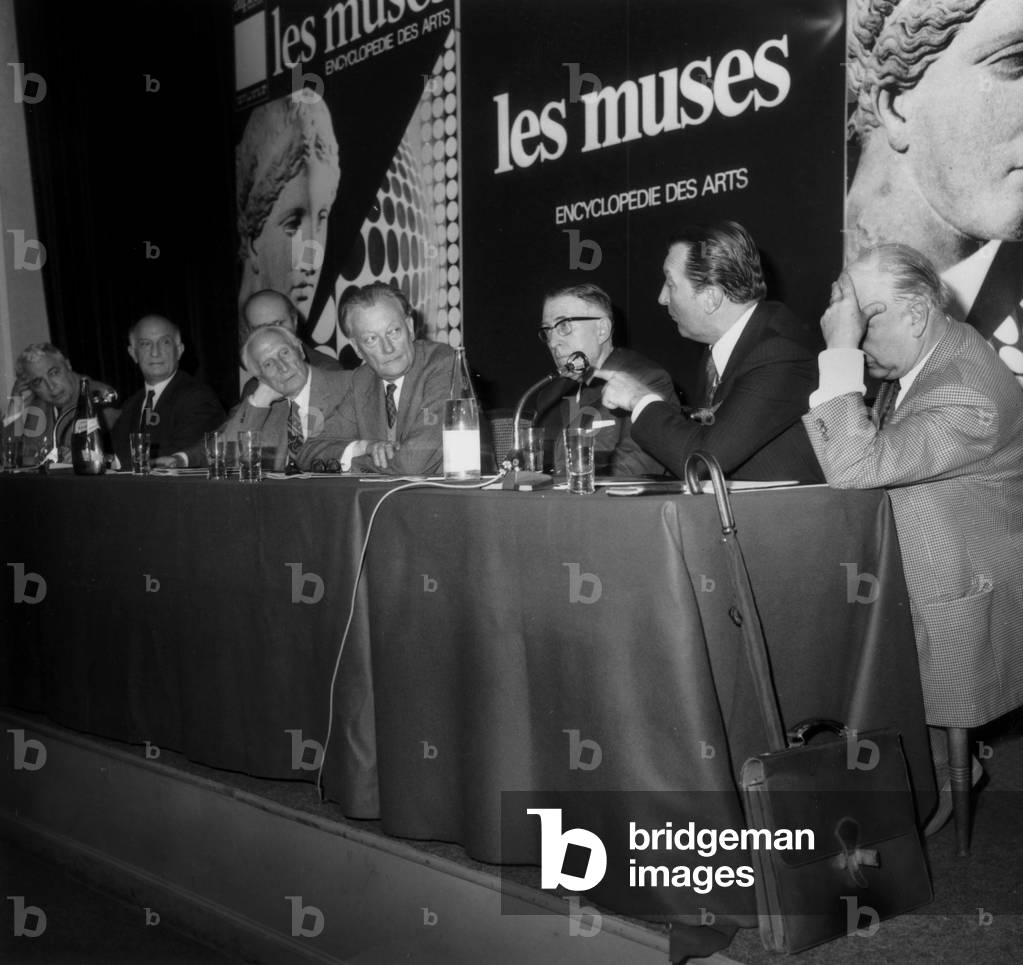 Andre Parrot (Director of Louvre), Raymond Cogniat, Berto Lardera (Artist), Marcel Brion, Rene Huyghe (Curator at Louvre), Michel Florisoone, Gerald Van Der Kemp (Curator in Versailles) and Adam Saulnier on September 27, 1969 (b/w photo)