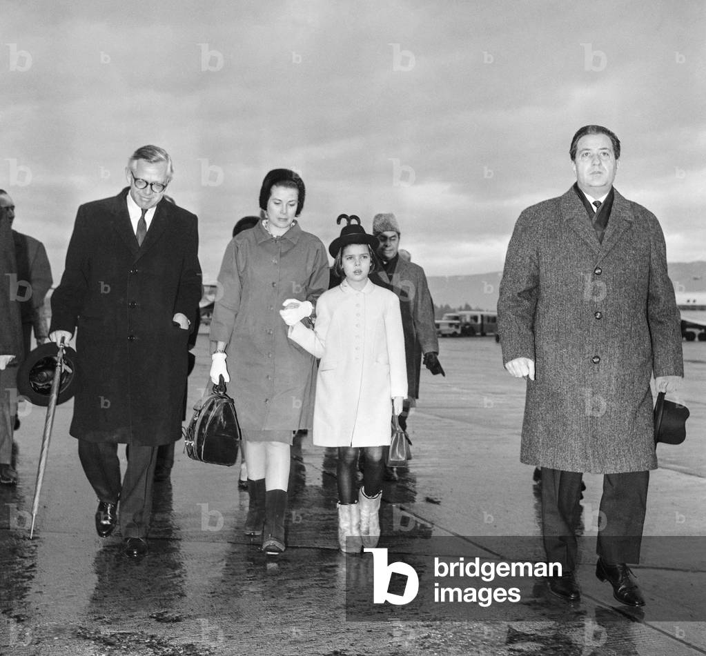 Princess Grace of Monaco and Princess Caroline arriving at Geneva airport, welcome by Canadian ambassador Mr Rae, on February 22, 1966 (b/w photo)