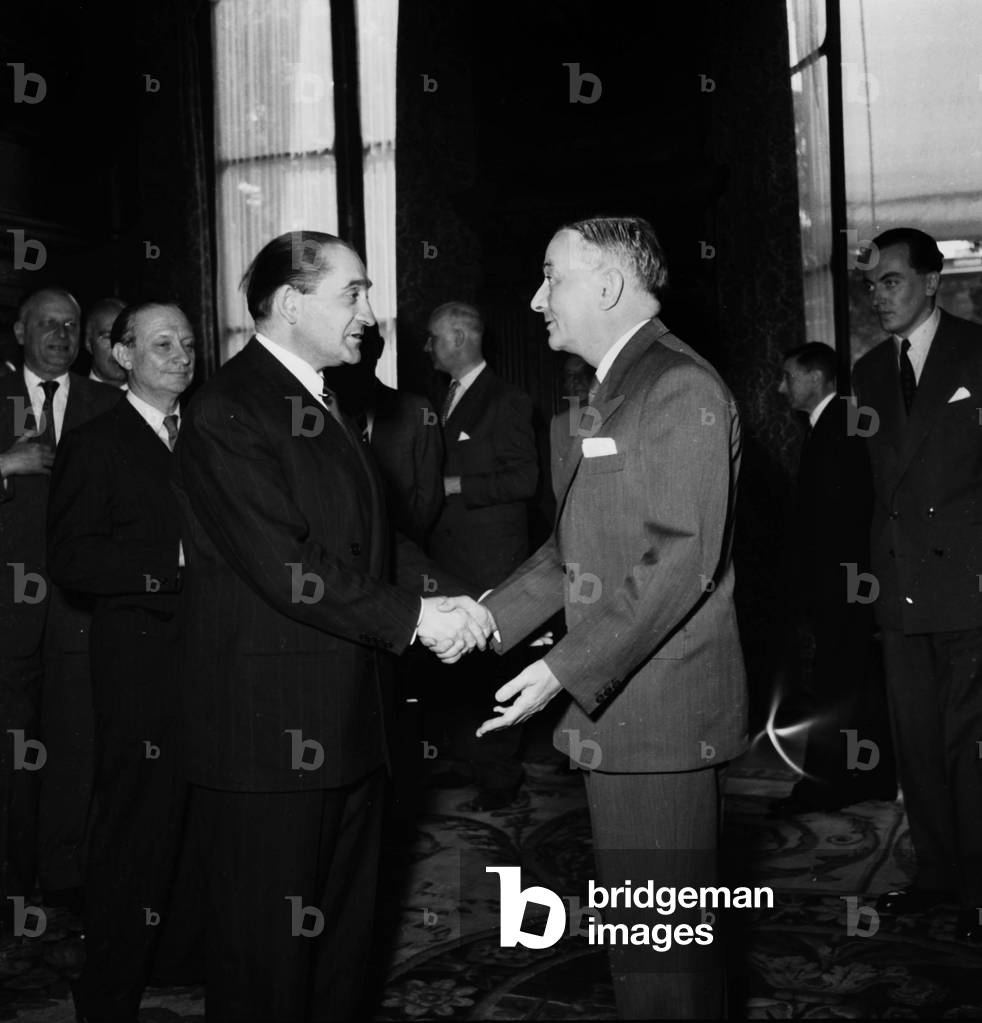 Transfer of Power at French Ministry of Foreign Affairs in Paris on June 20, 1954 : Pierre Mendes France, New French Minister of Foreign Affairs, Shaking Hands With Georges Bidault, The Former One, Back on L : Jean Michel Guerin Du Boscq De Beaumont, Secretary of State and on R : Andre Bettencourt (b/w photo)