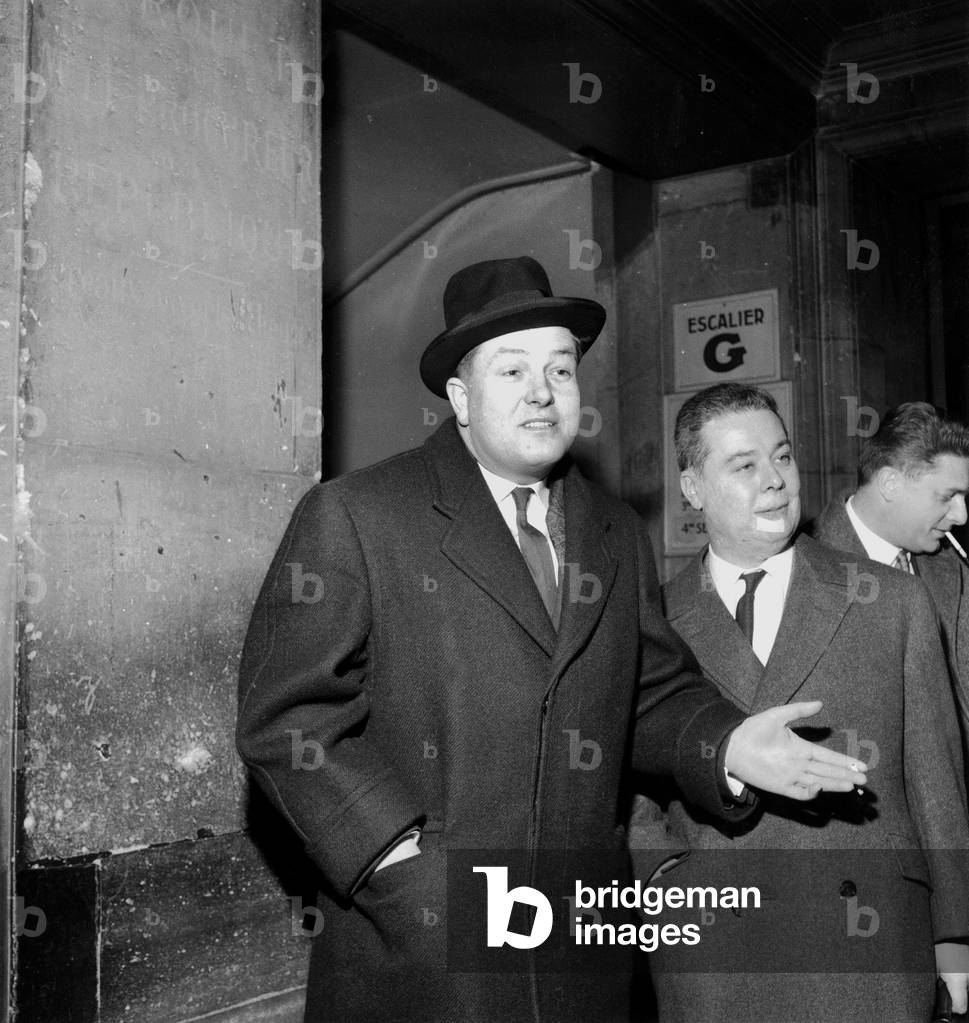French Deputy Jean-Marie Le Pen during Trial For Having Made Death Threats here With his Lawyer Me Menuet February 9, 1960 (b/w photo)