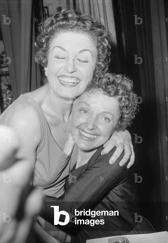 French singer Edith Piaf congratulated by Nita Raya after her concert at the Olympia, Paris, November 21, 1959 (b/w photo)