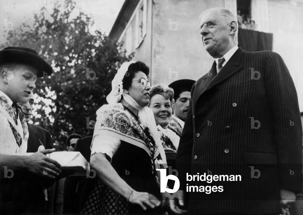 A Boy Is Giving Nougat To French President Charles De Gaulle, in Montelimar, October 22, 1960 (b/w photo)