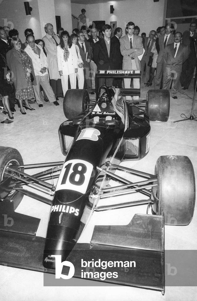 French racing driver Paul Belmondo at the display of his new Voiture 3000 in Paris on April 4, 1991 (b/w photo)