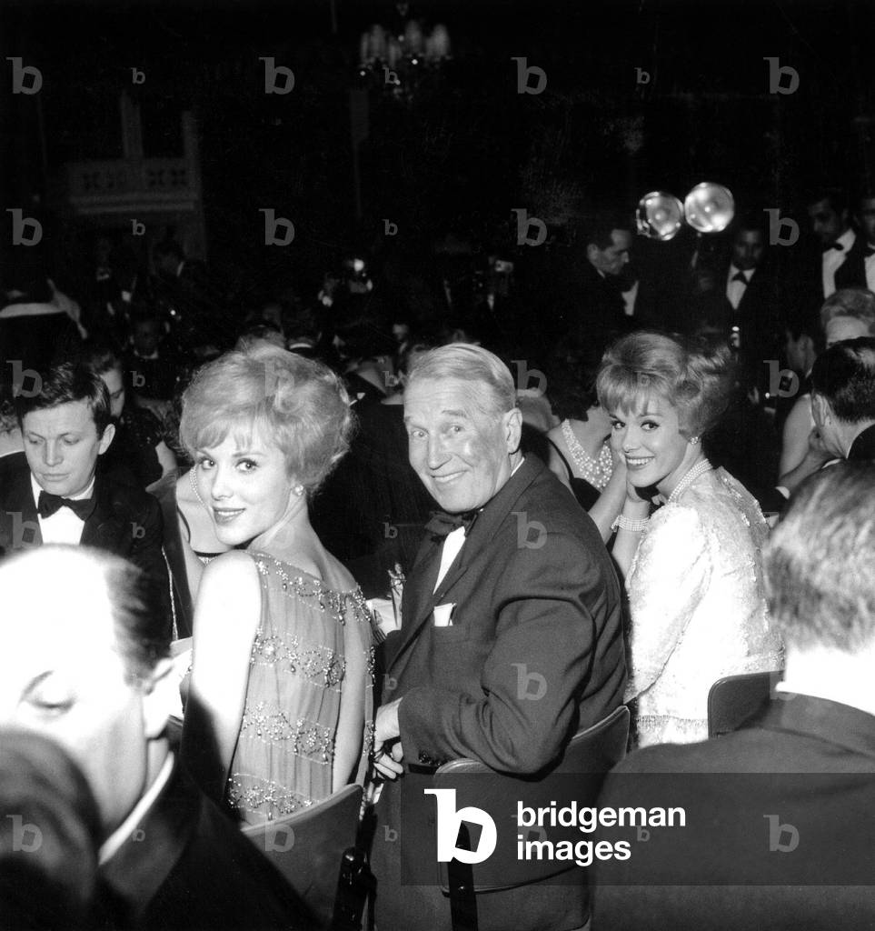 French Singer Maurice Chevalier With The Kessler Sisters, Alice and Ellen December 19, 1962 (b/w photo)