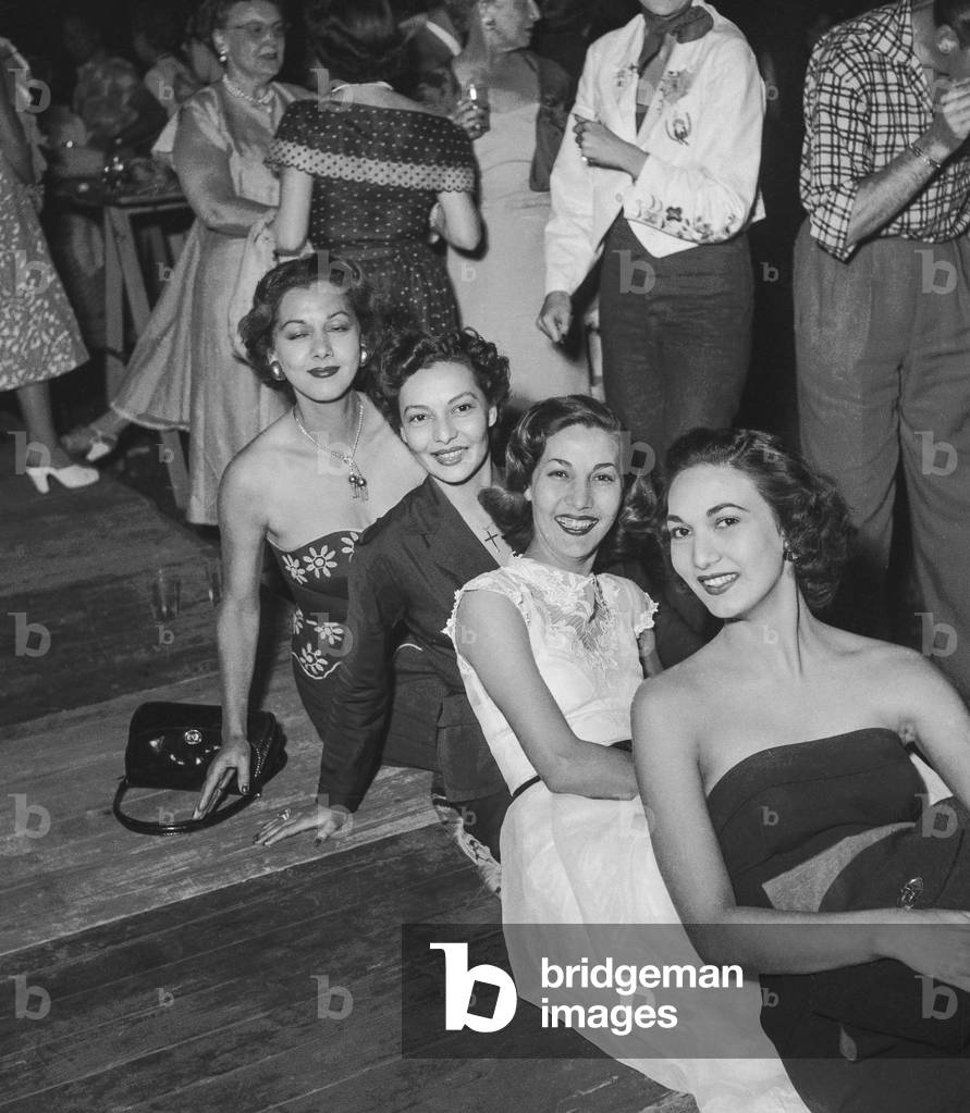 Actress Maria Montez and her sisters (l-r : Maria, Ada, Lupita, Teresita) during a party given by JacquesFath, Paris, August 7, 1950 (b/w photo)