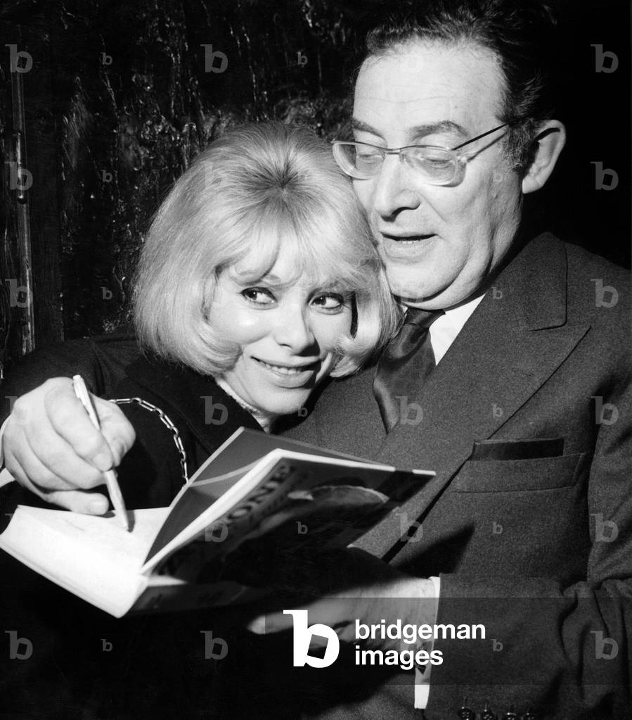 French Journalist Leon Zitrone Holding Actress Mireille Darc in his Arms during Presentation of his Book 