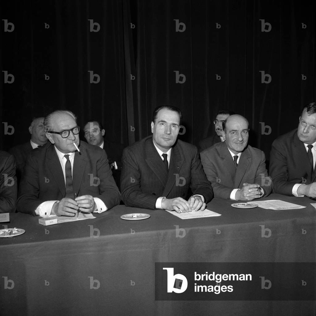Meeting at the Cercle Republicain in Paris dor election of the president of the FGSD (Federation of the Democratic and Socialist Left) : Guy Mollet, Francois Mitterrand, Rene Billeres and Charles Hernu, December 9, 1965 (b/w photo)