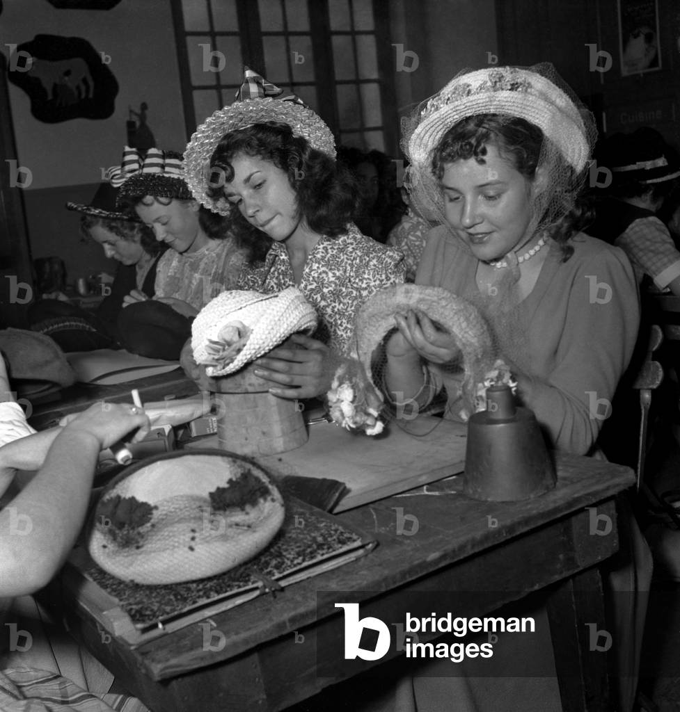 Young Women Preparing The Cap (French Diploma) To Be Milliner, Paris, July 3, 1948 (b/w photo)