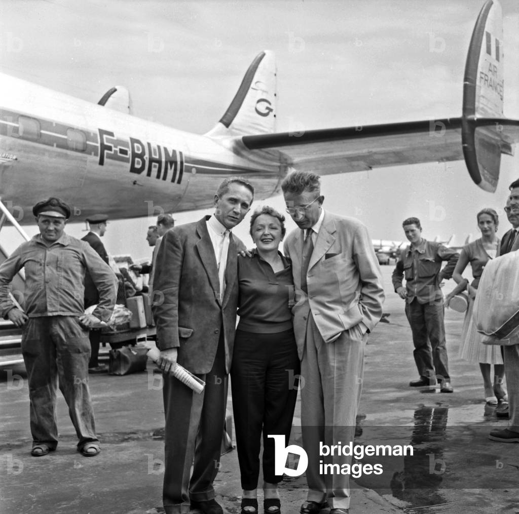 Edith Piaf Welcome By Marcel Blistene and Michel Emer at Orly Airport, Paris, August 8, 1957 (b/w photo)
