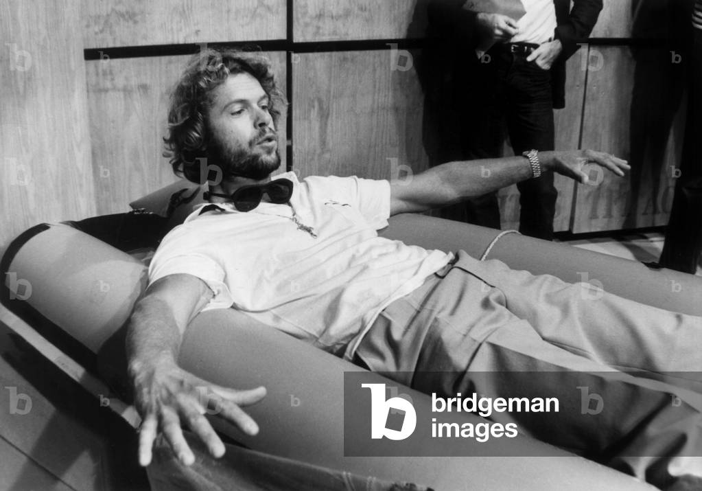 Arnaud De Rosnay Explaining His Exploit On Windsurfing September 19, 1980 On A Television Show Here Showing How He Rest And Slept On His Board (b/w photo)